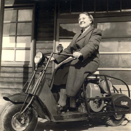 Mabel Francis, sitting on a motorcycle